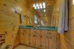 Master bathroom offers a large shower stall and jetted garden tub 